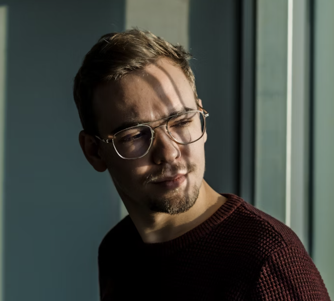 Man wearing glasses and sweater